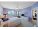 Bright main bedroom with waterfront view from the windows and access to a balcony at 7872 Sailboat Key S Blvd # 602, South Pasadena, FL 33707