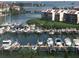 Picturesque marina view with numerous boats docked and waterfront condos in the background at 7872 Sailboat Key S Blvd # 602, South Pasadena, FL 33707