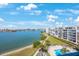 Beautiful water view with lush landscaping and a multi-story condo building at 7872 Sailboat Key S Blvd # 602, South Pasadena, FL 33707