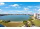 Expansive water view with lush landscaping, sandy beaches, and a condominium building at 7872 Sailboat Key S Blvd # 602, South Pasadena, FL 33707