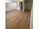 This bedroom showcases modern flooring, a spacious layout, and a nearby door to an additional room at 816 Drane Nw St, Plant City, FL 33563