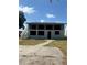 A quaint, traditional-style two-story home with a welcoming facade and sunlit surroundings at 816 Drane Nw St, Plant City, FL 33563