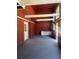 Spacious garage with high ceilings, natural light, white cabinetry, and convenient access to home and outdoors at 816 Drane Nw St, Plant City, FL 33563