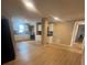 Open floorplan integrating kitchen, dining, and living areas showcases modern flooring and stainless-steel appliances at 816 Drane Nw St, Plant City, FL 33563