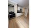 Kitchen with stainless steel appliances, white cabinets, and a modern backsplash at 816 Drane Nw St, Plant City, FL 33563