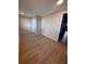 Spacious living room with wood floors and a view into the hallway at 816 Drane Nw St, Plant City, FL 33563