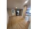 Open living room with a stainless steel fridge, bright walls, and modern flooring at 816 Drane Nw St, Plant City, FL 33563