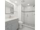 Modern bathroom with glass shower, sleek vanity, and stylish tile work, creating a spa-like retreat at 8212 Malvern Cir, Tampa, FL 33634