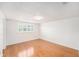 Bright bedroom with hardwood floors, a large window, and ample natural light at 8212 Malvern Cir, Tampa, FL 33634