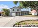 Charming two-story home featuring a well-maintained yard and a spacious driveway at 8212 Malvern Cir, Tampa, FL 33634