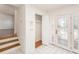 Bright foyer with decorative glass door, tile flooring, and closet space at 8212 Malvern Cir, Tampa, FL 33634