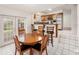 Charming kitchen with tiled floors, a breakfast bar, and stainless steel appliances, perfect for entertaining at 8212 Malvern Cir, Tampa, FL 33634