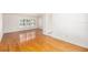 Open living space with hardwood floors and plenty of natural light from a large window at 8212 Malvern Cir, Tampa, FL 33634