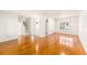 Spacious living room with hardwood floors, abundant natural light, and staircase access at 8212 Malvern Cir, Tampa, FL 33634