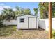 Backyard shed with window and white fence surrounding property at 8212 Malvern Cir, Tampa, FL 33634