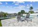 Backyard featuring a pool, canal access, and lounge chairs on a paver patio at 8706 Driftwood Dr, Tampa, FL 33615