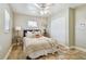 Cozy bedroom featuring a queen-sized bed, closet with tile floors, and natural lighting at 8706 Driftwood Dr, Tampa, FL 33615