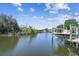 A boat is lifted on a boat lift in the canal at 8706 Driftwood Dr, Tampa, FL 33615