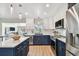 Stylish kitchen featuring stainless steel appliances and a charming island at 8706 Driftwood Dr, Tampa, FL 33615