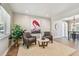 Comfortable living room with stylish seating, wood floors, and bright natural light at 8706 Driftwood Dr, Tampa, FL 33615