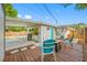 Backyard patio featuring outdoor seating, a grill, and access to a refreshing swimming pool at 9086 Enchantment Dr, Largo, FL 33773