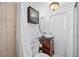 Bright bathroom with modern fixtures, vanity, vessel sink, and tiled shower at 9086 Enchantment Dr, Largo, FL 33773