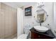 Bathroom with custom vanity, vessel sink, and tiled shower at 9086 Enchantment Dr, Largo, FL 33773