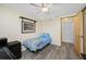 Bedroom features hard surface flooring, ceiling fan, and is brightly lit at 9086 Enchantment Dr, Largo, FL 33773