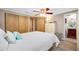 Bright bedroom with ceiling fan, and ensuite bathroom with stylish vanity at 9086 Enchantment Dr, Largo, FL 33773