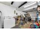 Organized garage space featuring a workbench, storage, and ample room for hobbies and projects at 9086 Enchantment Dr, Largo, FL 33773