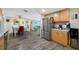 Bright kitchen with stainless steel appliances and direct view of the dining area at 9086 Enchantment Dr, Largo, FL 33773