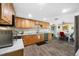Well-lit kitchen with stainless steel appliances and open access to the dining area at 9086 Enchantment Dr, Largo, FL 33773