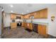 Charming kitchen with stainless steel appliances and wood-look flooring at 9086 Enchantment Dr, Largo, FL 33773
