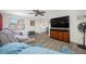 Comfortable living room with wood-look flooring and view to dining area at 9086 Enchantment Dr, Largo, FL 33773
