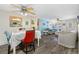 Bright living room featuring a ceiling fan, modern furniture, and an open floorplan at 9086 Enchantment Dr, Largo, FL 33773