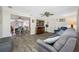 Comfortable living room showcases wood-look flooring and direct access to dining room at 9086 Enchantment Dr, Largo, FL 33773