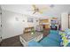 Bright living room featuring modern decor and an open layout leading to the kitchen at 9086 Enchantment Dr, Largo, FL 33773