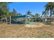 Community bocce ball courts with bench seating and shade canopies at 7519 Berna Ln, Land O Lakes, FL 34637