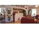 Spacious living room featuring hardwood floors and decorative accents on the walls and shelves at 7519 Berna Ln, Land O Lakes, FL 34637