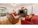 Bright living room with hardwood floors and comfortable furniture for relaxing and entertaining at 7519 Berna Ln, Land O Lakes, FL 34637