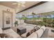 Inviting screened patio with a hammock, seating area, and serene backyard views at 7519 Berna Ln, Land O Lakes, FL 34637