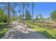Picturesque walking path through a community park with tennis courts and picnic spots in the background at 7519 Berna Ln, Land O Lakes, FL 34637