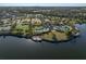 An aerial view highlighting the community pool, tennis court, parking, and surrounding neighborhood at 10005 Sage Creek Dr, Ruskin, FL 33573
