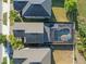 Aerial view of a house with a screened pool and well-maintained landscaping in a suburban neighborhood at 10005 Sage Creek Dr, Ruskin, FL 33573