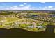 Aerial view showcasing the community layout, amenities and its proximity to the lake and surrounding neighborhoods at 10005 Sage Creek Dr, Ruskin, FL 33573