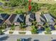 Aerial view of home with screened pool, situated among similar residences, offering a sense of community at 10005 Sage Creek Dr, Ruskin, FL 33573
