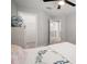 Comfortable bedroom featuring a view into the walk-in closet and a decorative pillow on the bed at 10005 Sage Creek Dr, Ruskin, FL 33573