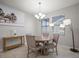 Cozy dining area featuring a round table with four chairs and bright, natural light at 10005 Sage Creek Dr, Ruskin, FL 33573