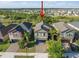 Two-story home with neutral-colored siding, symmetrical windows, well-manicured lawn and landscaping at 10005 Sage Creek Dr, Ruskin, FL 33573