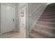 Inviting foyer with a view of a carpeted staircase and a glimpse into the half-bathroom at 10005 Sage Creek Dr, Ruskin, FL 33573